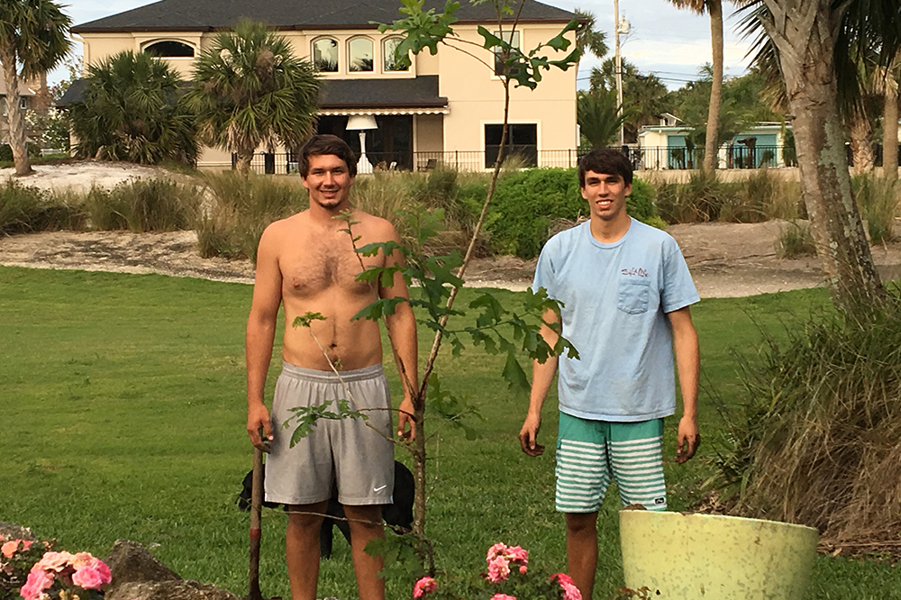 Will & Ben Planting Tree in Backyard